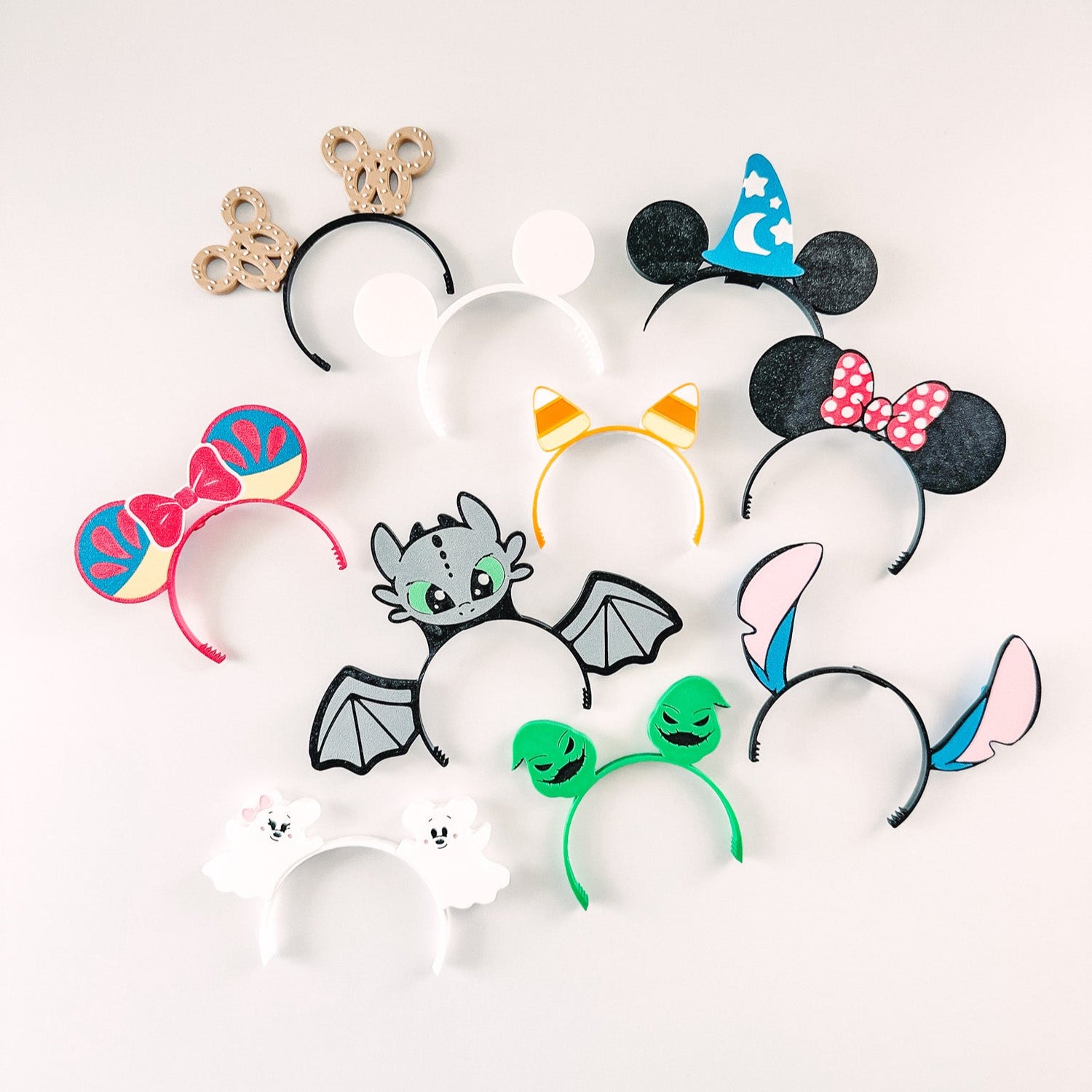 Set of colorful mouse ears with various designs on a white background