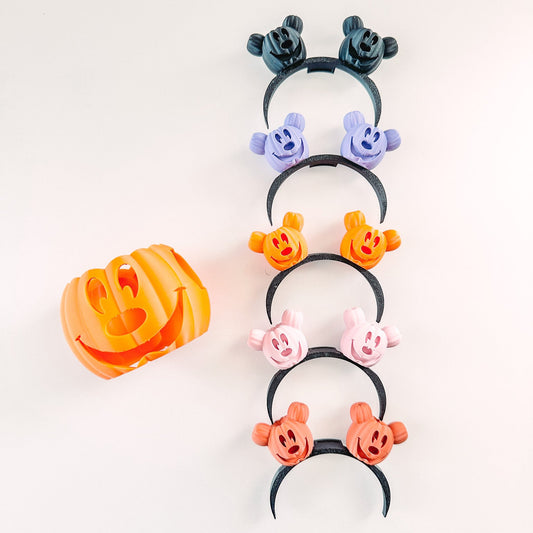 Set of colorful Halloween-themed hair ties on a white background