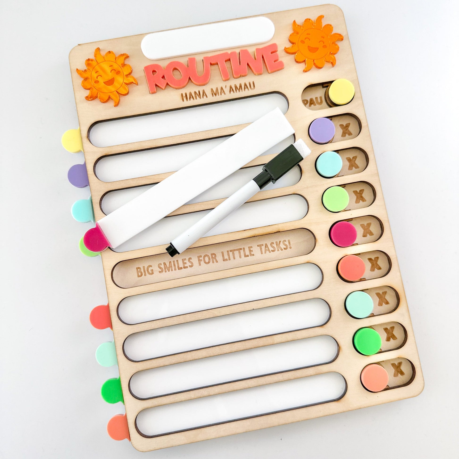 Wooden children's chore chart with colorful markers on a white background