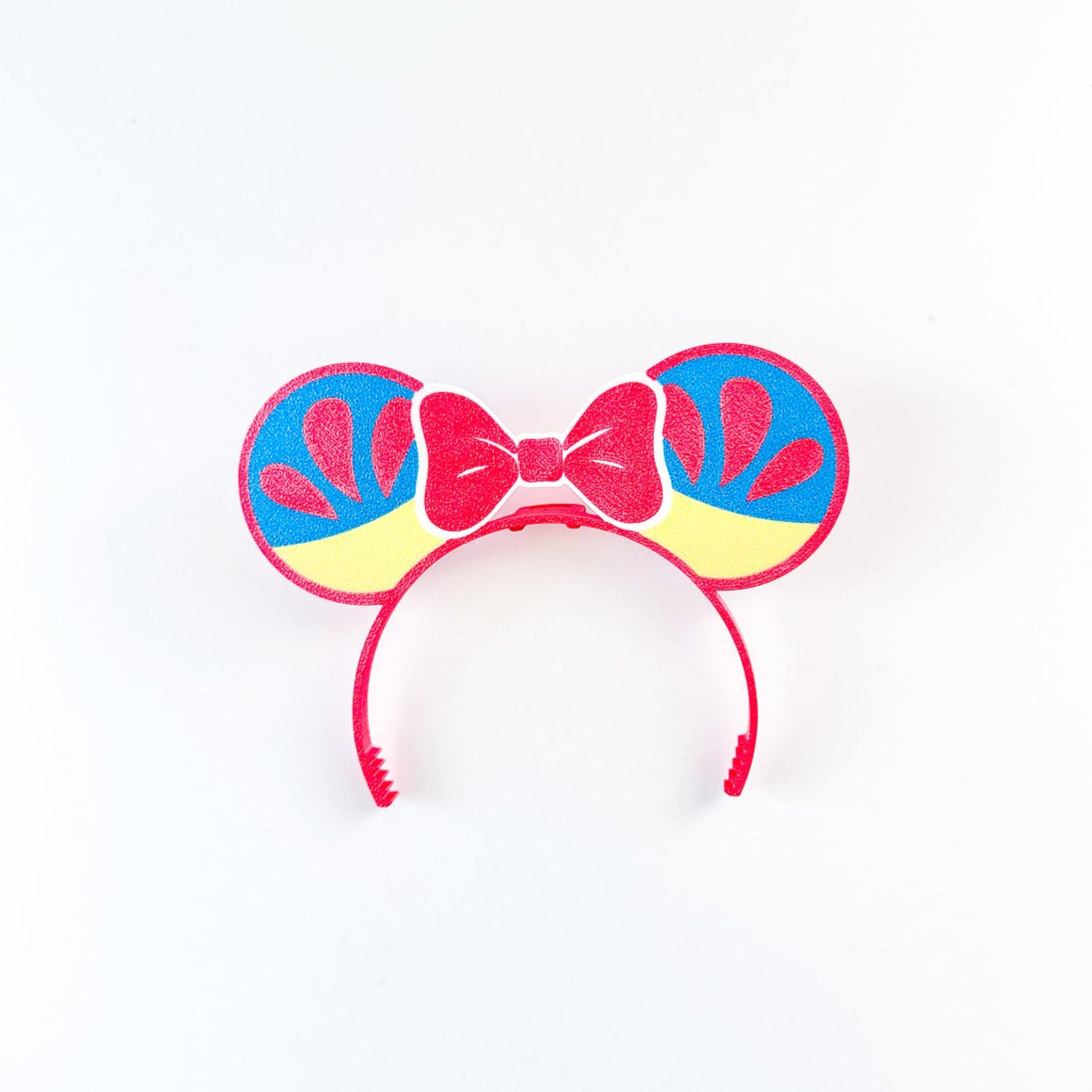 Colorful headband with bow and peace signs on a white background