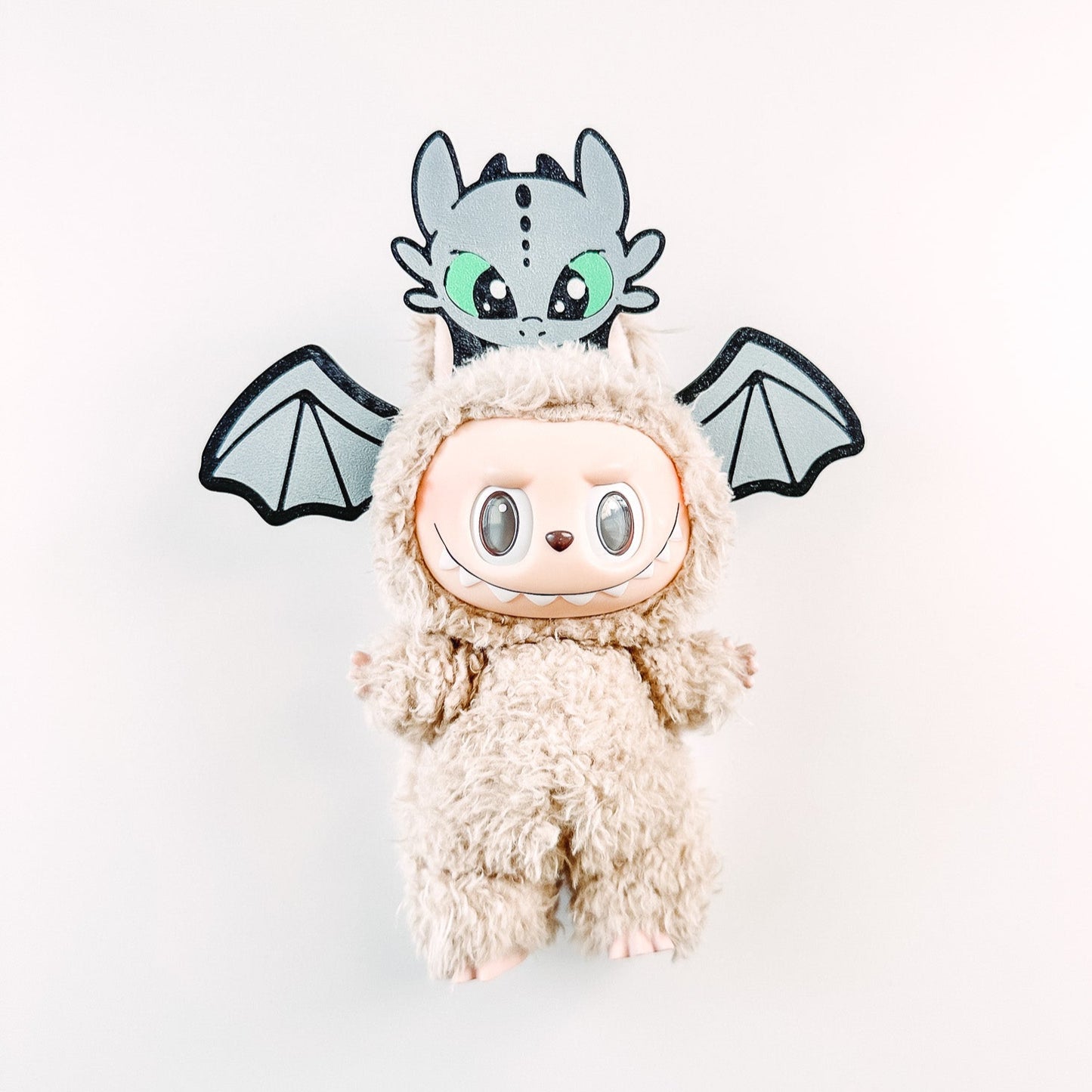 Plush toy with a dragon head on a white background